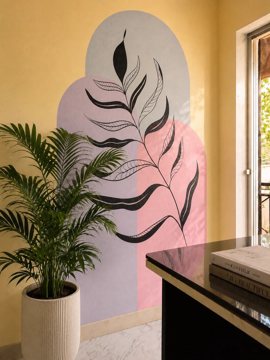 Botanical wall mural and indoor planting in a Disha Archilab interior